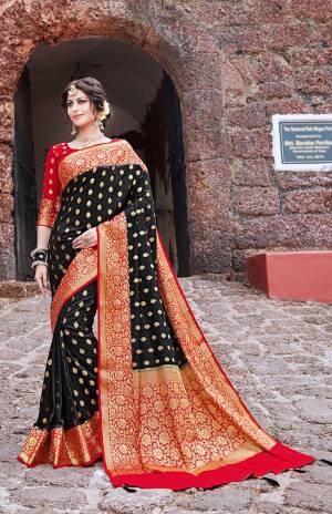 Enhance Your Personality Wearing This Heavy Weaved Saree In Black Color Paired With Contrasting Red Colored Blouse. This Saree And Blouse Are Fabricated on Nylon Art Silk Beautified With Weaving And Stone Work. Buy This Pretty Saree Now.