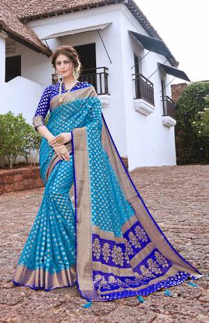 Add This Very Pretty Designer Silk Based Saree To Your Wardrobe For The Upcoming Festive Season With This Saree In Blue Color Paired With Contrasting Royal Blue Colored Blouse. This Saree And Blouse Are Fabricated On Nylon Art Silk Which Gives A Rich Look To Your Personality. 