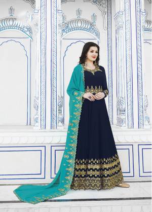 Enhance Your Personality Wearing This Designer Floor Length Suit In Navy Blue Color Paired With Blue Colored Dupatta. Its Embroidered Top And Dupatta Are Georgette Based Paired With Santoon Fabricated Bottom. Buy Now.