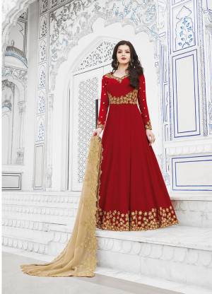 Adorn The Pretty Angelic Look Wearing This Designer Floor Length Suit In Red Color Paired With Beige Colored Dupatta. Its pretty Embroidered Top And Dupatta Are Fabricated On Georgette Paired With Santoon Bottom. 