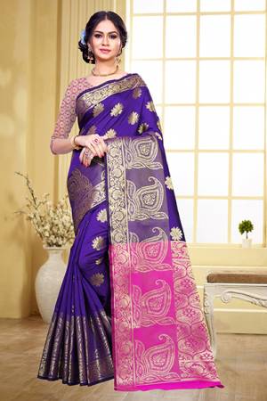 Grab This Beautiful Designer Silk Based Saree In Purple Color Paired With Contrasting Pink Colored Blouse. This Saree And Blouse Are Fabricated On Art Silk Beeautified With Weave Motifs All Over The Saree. This Saree Is Durable, Light Weight And Easy To Carry All Day Long. 