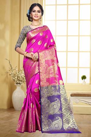 Grab This Beautiful Designer Silk Based Saree In Rani Pink Color Paired With Contrasting Purple Colored Blouse. This Saree And Blouse Are Fabricated On Art Silk Beeautified With Weave Motifs All Over The Saree. This Saree Is Durable, Light Weight And Easy To Carry All Day Long. 