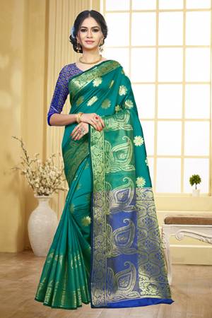 Grab This Beautiful Designer Silk Based Saree In Teal Blue Color Paired With Contrasting Violet Colored Blouse. This Saree And Blouse Are Fabricated On Art Silk Beeautified With Weave Motifs All Over The Saree. This Saree Is Durable, Light Weight And Easy To Carry All Day Long. 