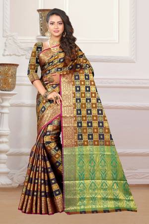 If You Have An Eye For Intricate Designs Than Grab This Very Pretty Heavy Weaved Designer Saree In Brown And Navy Blue Color Fabricated On Patola Art Silk. It Is Beautified With Weave In Checks Pattern. This Saree Is Easy To Drape And Durable. Buy Now.