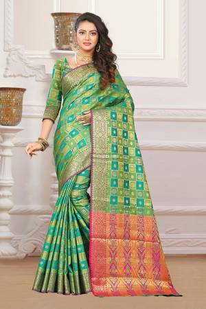 If You Have An Eye For Intricate Designs Than Grab This Very Pretty Heavy Weaved Designer Saree In Green And Blue Color Fabricated On Patola Art Silk. It Is Beautified With Weave In Checks Pattern. This Saree Is Easy To Drape And Durable. Buy Now.