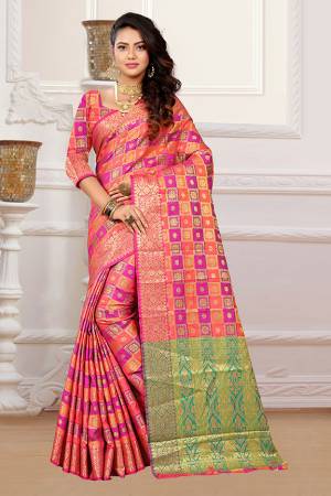 If You Have An Eye For Intricate Designs Than Grab This Very Pretty Heavy Weaved Designer Saree In Rani Pink & Orange Color Fabricated On Patola Art Silk. It Is Beautified With Weave In Checks Pattern. This Saree Is Easy To Drape And Durable. Buy Now.