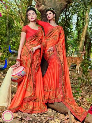 Celebrate This Festive Season With Beauty And Comfort Wearing This Designer Satin Based Saree In Orange Color Paired With Orange Colored Blouse. It IS Beautified With Attractive Embroidery All over. 