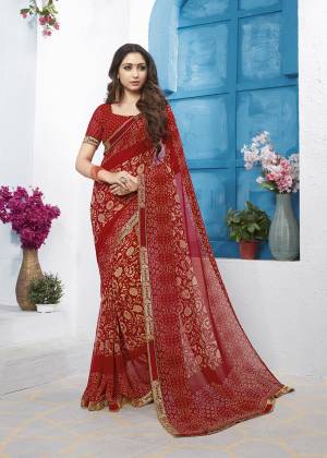 Grab This Very Pretty Printed Saree In Red Color Paired With Red Colored Blouse. This Saree And Blouse Are Fabricated On Georgette Beautified With Prints All Over. This Saree IS Light In Weight And Easy To Carry All Day Long. 