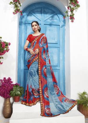 Simple And Elegant Looking Printed Saree Is Here In Blue And Red Color Paired With Red Colored Blouse. This Saree And Blouse are Georgette Based Beautified With Prints All Over. 