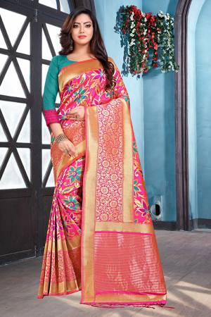 Bright And Visually Appeling Color Is Here With This Designer Silk Based Saree In Fuschia Pink Color Paired With Contrasting Teal Blue Colored Blouse. This Saree And Blouse are Fabricated On Art Silk Beautified With Bold Weave All Over. 
