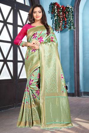 Look Pretty In This Lovely Pastel Green Colored Saree Paired With Contrasting Dark Pink Colored Blouse, This Saree And Blouse are Fabricated On Art Silk Beautified With Weave All Over. Buy This Pretty Saree Now. 