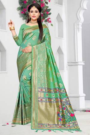 Look Pretty In This Lovely Green Colored Saree Paired With Green Colored Blouse, This Saree And Blouse are Fabricated On Art Silk Beautified With Weave All Over. Buy This Pretty Saree Now. 