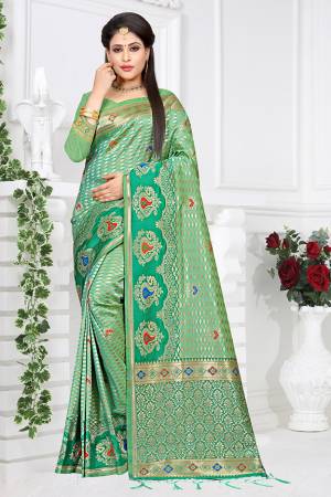 Look Pretty In This Lovely Green Colored Saree Paired With Green Colored Blouse, This Saree And Blouse are Fabricated On Art Silk Beautified With Weave All Over. Buy This Pretty Saree Now. 