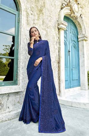 Celebrate This Festive Season With Beauty And Comfort Wearing This Designer Saree In Royal Blue Color Paired With Royal Blue Colored Blouse. This Saree Is Fabricated On Satin Silk Paired With Art Silk Fabricated Blouse. It Has Pretty Tone To Tone Resham Embroidery With Stone Work.