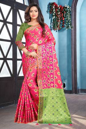Bright And Visually Appealing Color Is Here With This Saree In Fuschia Pink Color Paired With Contrasting Green Colored Blouse. This Saree And blouse are Silk Based Which Gives A Rich Look To Your Personality. 
