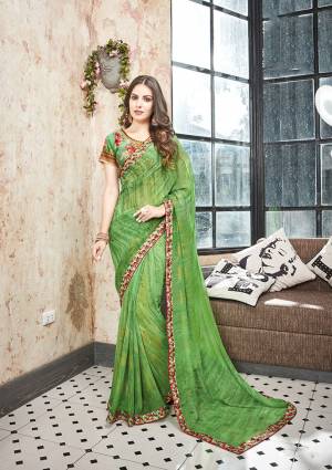 Celebrate This Festive Season With Beauty And Comfort Wearing This Pretty Floral Printed Saree In Green Color Paired With Green Colored Blouse. This Saree Is Georgette Based Which Is Light Weight And Ensures Superb Comfort All Day Long. 