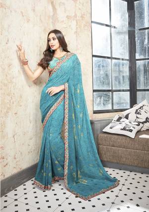 Celebrate This Festive Season With Beauty And Comfort Wearing This Pretty Floral Printed Saree In Sky Blue Color Paired With Sky Blue Colored Blouse. This Saree Is Georgette Based Which Is Light Weight And Ensures Superb Comfort All Day Long. 