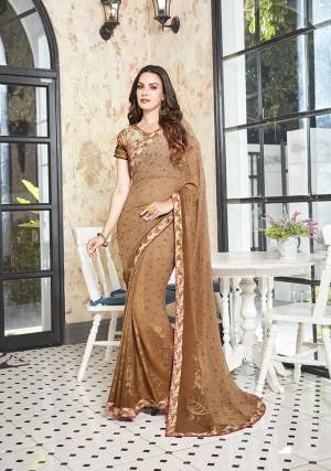 Simple And Elegant Looking Pretty Printed Saree Is Here In Beige Color Paired With Beige Colored Blouse. This Georgette Based Saree Is Beautified With Floral And Foil Prints Also It Is Light Weight And Easy To Carry All Day Long. 