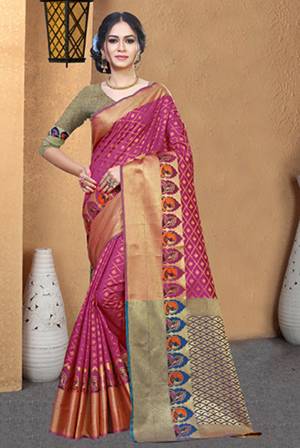 Rich And Elegant Looking Silk Based Designer Saree Is Here In Magenta Pink Color Paired With Contrasting Blue Colored Blouse. This Saree And Blouse Are Fabricated On Patola Art Silk Beautified With Weave All Over. 