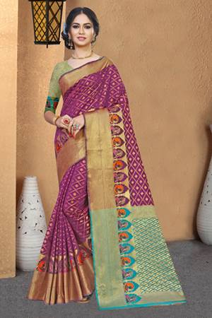 Rich And Elegant Looking Silk Based Designer Saree Is Here In Magenta Pink Color Paired With Contrasting Turquoise Blue Colored Blouse. This Saree And Blouse Are Fabricated On Patola Art Silk Beautified With Weave All Over. 