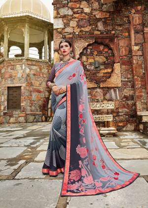 Flaunt Your Rich And Elegant Taste Wearing This Pretty Saree In Shades Of Grey. This Saree And Blouse Are Fabricated On Weightless Georgette Beautified With Abstract And Floral Prints. 
