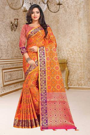 Enhance Your Personality In This Very Beautiful Heavy Weaved Silk Based Saree In Orange Color Paired With Contrasting Pink Colored Blouse. This Saree And Blouse Are Fabricated On Patola Art Silk Beautified With Heavy Intricate Weave All Over. Buy This Saree Now.