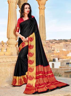 For A Bold Beauty, Grab This Silk Based Saree In Black Color Paired With Red Colored Blouse. This Saree And Blouse Are Fabricated On Banarasi Art Silk Beautified With Weave. This Saree Is Light Weight And Easy To Drape Which Ensures Superb Comfort All Day Long. 