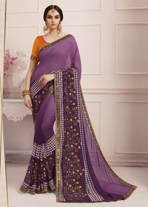 Catch All The Limelight Wearing This Beautiful Printed Saree In Purple Color Paired With Contrasting Orange Colored Blouse. This Saree Is Fabricated On Georgette Paired With Art Silk Fabricated Blouse. It Is Light Weight, Easy To Drape And Durable. Buy Now.