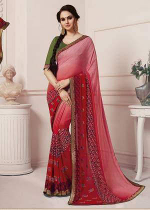 Here Is A Very Pretty Shaded Saree In Pink And Red Color Paired With Contrasting Dark Green Colored Blouse. This Saree Is Georgette Based Paired With Art Silk Fabricated Blouse. Buy This Pretty Saree Now.