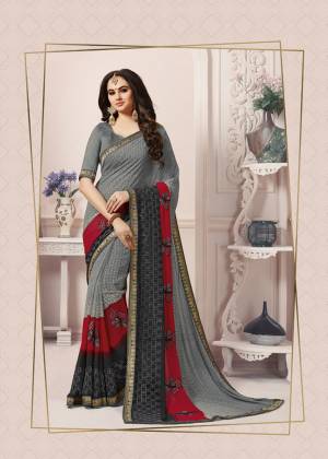 Flaunt Your Rich And Elegant Taste In This Elegant Looking Saree In Rich Grey Color Paired With Grey Colored Blouse. This Pretty Saree With Elegant Prints Is Fabricated On Georgette Paired With Art Silk Fabricated Blouse. Buy This Saree Now.