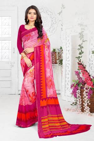 Go With The Shades Of Pink With This Pretty Saree In Pink Color Paired With Magenta Pink Colored Blouse. This Saree And Blouse Are Fabricated On Georgette Beautified With Prints All Over. 