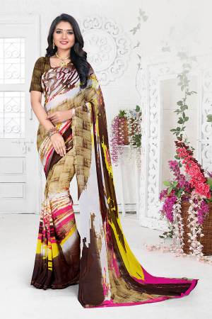 Add Colors To Your Wardrobe With Shades Of Brown With This Multi And Brown Colored Saree Paired With Brown Colored Blouse. This Saree And Blouse are Georgette Based Which Is Light Weight And Easy To Carry All Day Long. 