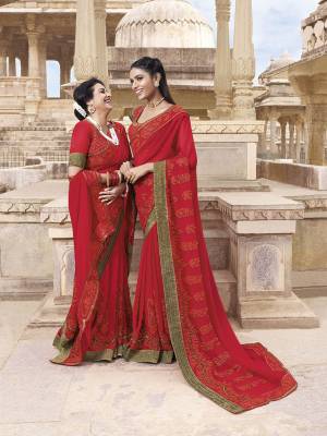 Adorn The Pretty Angelic Look Wearing This Heavy Designer Saree In Red Color Paired With Red Colored Blouse. This Heavy Tone To Tone Embroidered Saree Is Georgette Based Paired With Art Silk Fabricated Blouse. Buy This Saree Now.