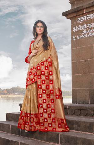 Flaunt Your Rich And Elegant Taste In This Designer Silk Based Saree In Beige Color Paired With Red Colored Blouse. This Saree And Blouse Are Fabricated On Nylon Art Silk Beautified With Weave All Over. This Saree Is Light Weight And Easy To Carry All Day Long. 