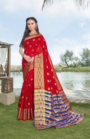 Celebrate This Festive Season With Beauty And Comfort Wearing This Silk Based Saree In Red Color Paired With Contrasting Royal Blue Colored Blouse. This Saree And Blouse Are Fabricated On Banarasi Art Silk Beautified With Weave All Over. Buy This Saree Now.