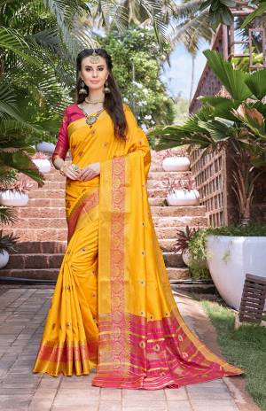 Celebrate This Festive Season With Beauty And Comfort Wearing This Silk Based Saree In Musturd Yellow Color Paired With Contrasting Pink Colored Blouse. This Saree And Blouse Are Fabricated On Banarasi Art Silk Beautified With Weave All Over. Buy This Saree Now.