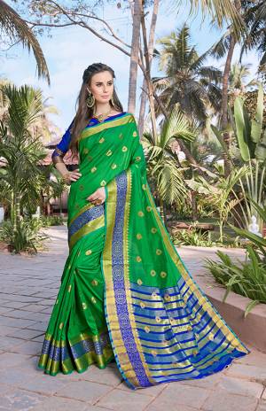 Celebrate This Festive Season With Beauty And Comfort Wearing This Silk Based Saree In Green Color Paired With Contrasting Royal Blue Colored Blouse. This Saree And Blouse Are Fabricated On Banarasi Art Silk Beautified With Weave All Over. Buy This Saree Now.