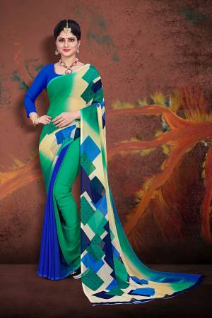 For Your Casual Wear, Grab This Pretty Printed Saree In Sea Green And Royal Blue Color Paired With Royal Blue Colored Blouse. This Saree And Blouse are Fabricated On Georgette Which Ensures Superb Comfort All Day Long. 