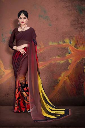 Beat The Heat This Summer Wearing This Light Weight Printed Saree In Brown Color Paired With Brown Colored Blouse. This Saree And Blouse Are Fabricated On Georgette. Buy Now.