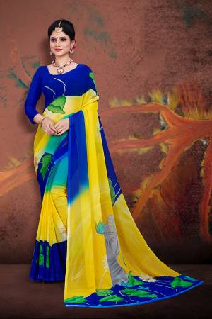 For Your Casual Wear, Grab This Pretty Printed Saree In Yellow And Royal Blue Color Paired With Royal Blue Colored Blouse. This Saree And Blouse are Fabricated On Georgette Which Ensures Superb Comfort All Day Long. 