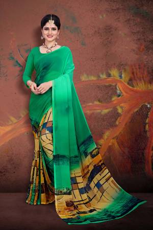 Beat The Heat This Summer Wearing This Light Weight Printed Saree In Green Color Paired With GreenColored Blouse. This Saree And Blouse Are Fabricated On Georgette. Buy Now.