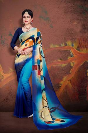 For Your Casual Wear, Grab This Pretty Printed Saree In Multi And Navy Blue Color Paired With Navy Blue Colored Blouse. This Saree And Blouse are Fabricated On Georgette Which Ensures Superb Comfort All Day Long. 