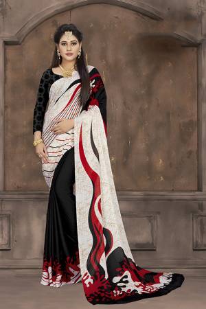 Add Some Casuals To Your Wardrobe With This Printed Saree In White And Black Color Paired With Black Colored Blouse. This Saree And Blouse Are Fabricated On Crepe Jacquard Beautified With Prints. 