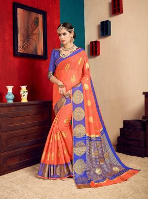 This Festive Season, Look The Most Pretty And Attractive of All Wearing This Saree In Orange Color Paired With Contrasting Violet Colored Blouse. This Saree Is Fabricated On Cotton Silk Paired With Art Silk Fabricated Blouse. Buy Now.