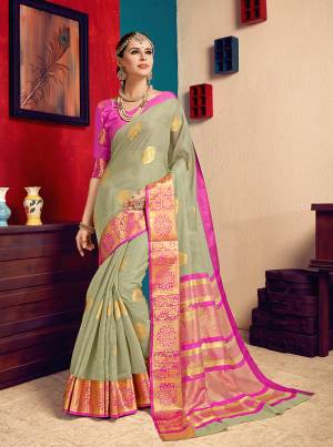 Beat The Heat This Summer With Pastels Wearing This Pretty Saree In Pastel Green Color Paired With Contrasting Rani Pink Colored Blouse. This Saree Is Fabricated On Cotton Silk Paired With Art Silk Fabricated Blouse. It Is Light Weight And Easy To Carry All Day Long. 