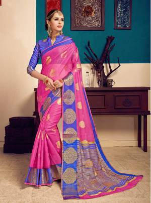 Catch All The Limelight When You Wear This Pretty Saree In Dark Pink Color Paired With Contrasting Blue Colored Blouse. This Saree Is Cotton Silk Based Paired With Art Silk Fabricated Blouse. Buy Now.