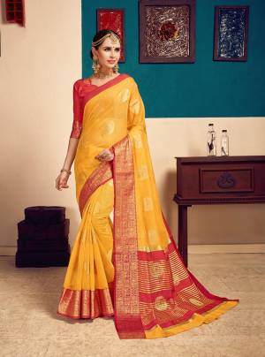 Beat The Heat This Summer Wearing This Pretty Saree In Yellow Color Paired With Contrasting Red Colored Blouse. This Saree Is Fabricated On Cotton Silk Paired With Art Silk Fabricated Blouse. It Is Light Weight And Easy To Carry All Day Long. 