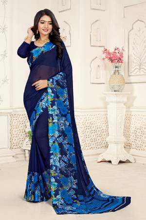 Add Some Casuals With This Rich And Elegant Looking Saree In Navy Blue Color Paired With Navy Blue Colored Blouse. This Saree And Blouse are Fabricated On Georgette Beautified With Minimal Prints. Also It Is Light Weight And Easy To Carry All Day Long. 