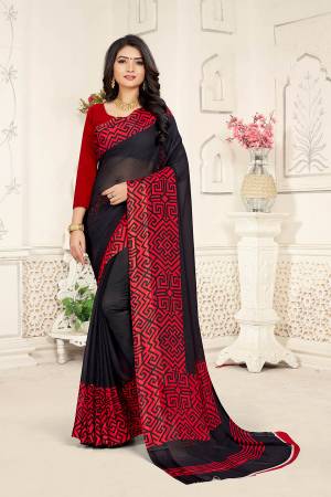 Add Some Casuals With This Rich And Elegant Looking Saree In Black Color Paired With Red Colored Blouse. This Saree And Blouse are Fabricated On Georgette Beautified With Minimal Prints. Also It Is Light Weight And Easy To Carry All Day Long. 