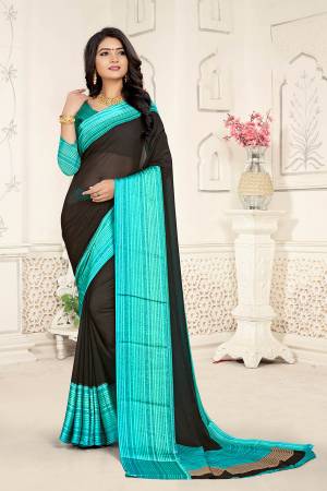 Add Some Casuals With This Rich And Elegant Looking Saree In Black Color Paired With Aqua Blue Colored Blouse. This Saree And Blouse are Fabricated On Georgette Beautified With Minimal Prints. Also It Is Light Weight And Easy To Carry All Day Long. 